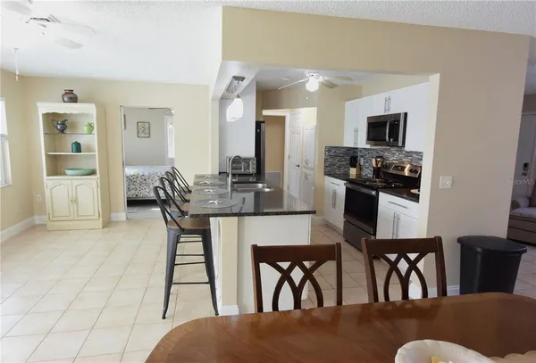 a dining room with furniture and window