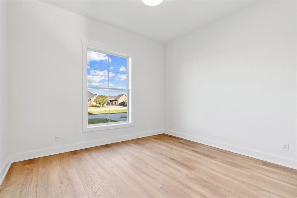 8008 Ben Day Murrin Road Fort Worth, TX 76126 - Photo 23 of 40 an empty room with a window