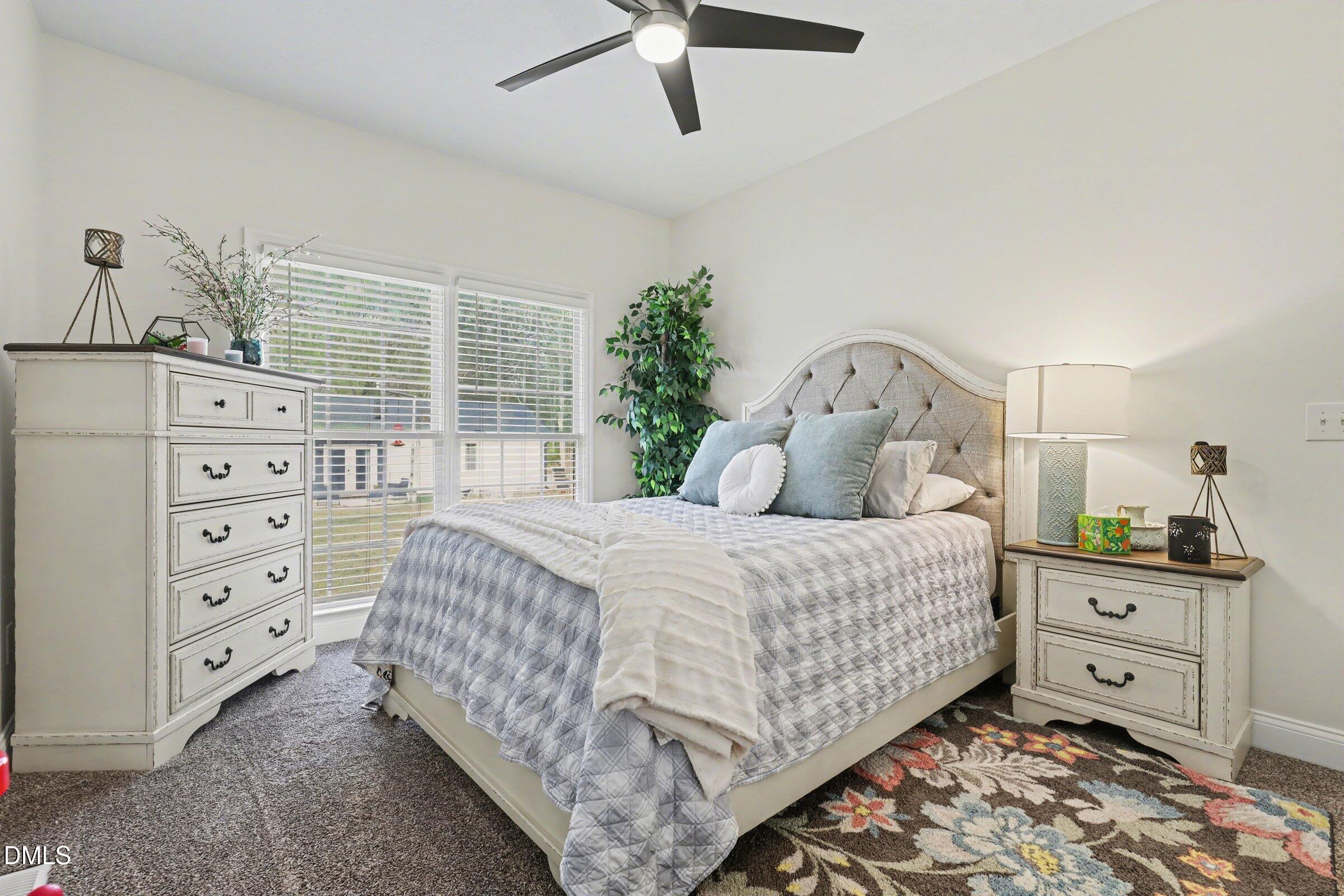 430 Fred Hall Road Stedman, NC 28391 - Photo 18 of 63 a bedroom with a bed and a dresser