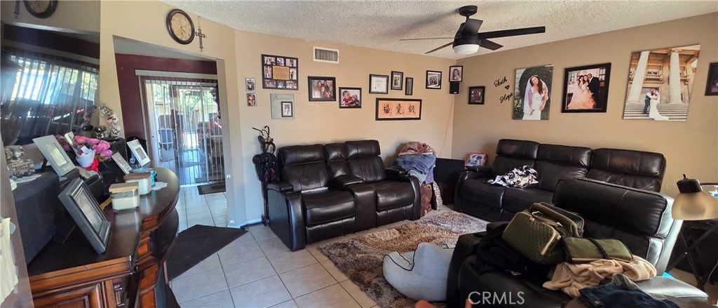 1548 Ranch Road San Bernardino, CA 92407 - Photo 3 of 26 a living room with furniture and a window