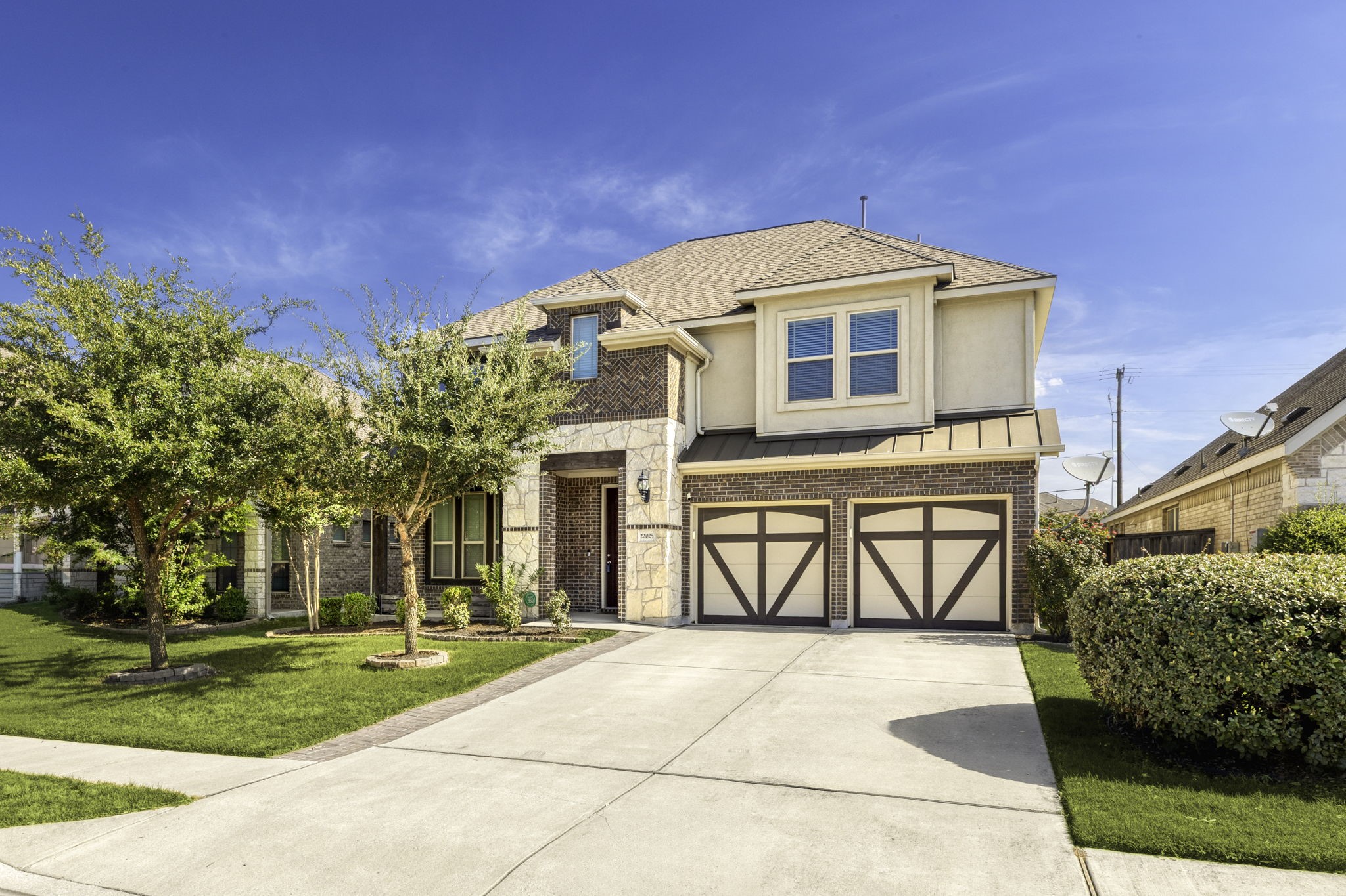 a front view of a house with garden