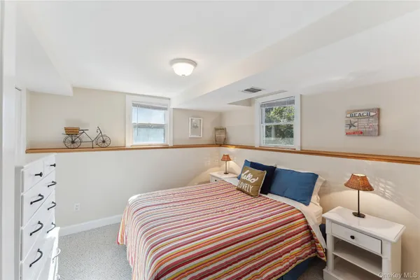 a bedroom with a bed and lamp