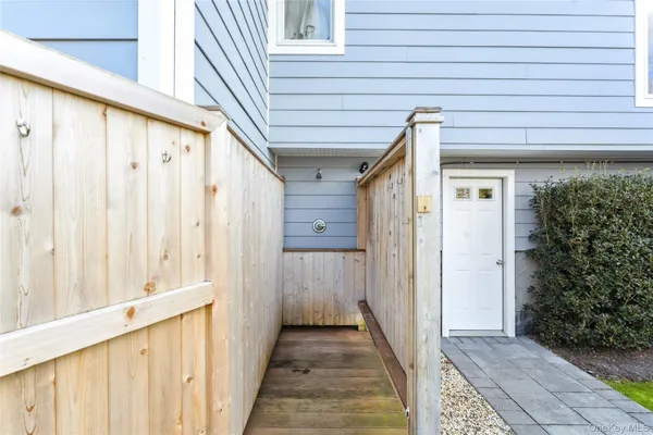 a view of a house with wooden walls