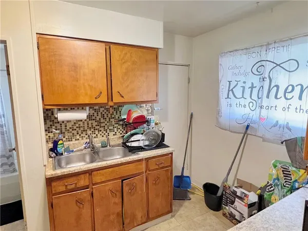 a kitchen with a sink and cabinets