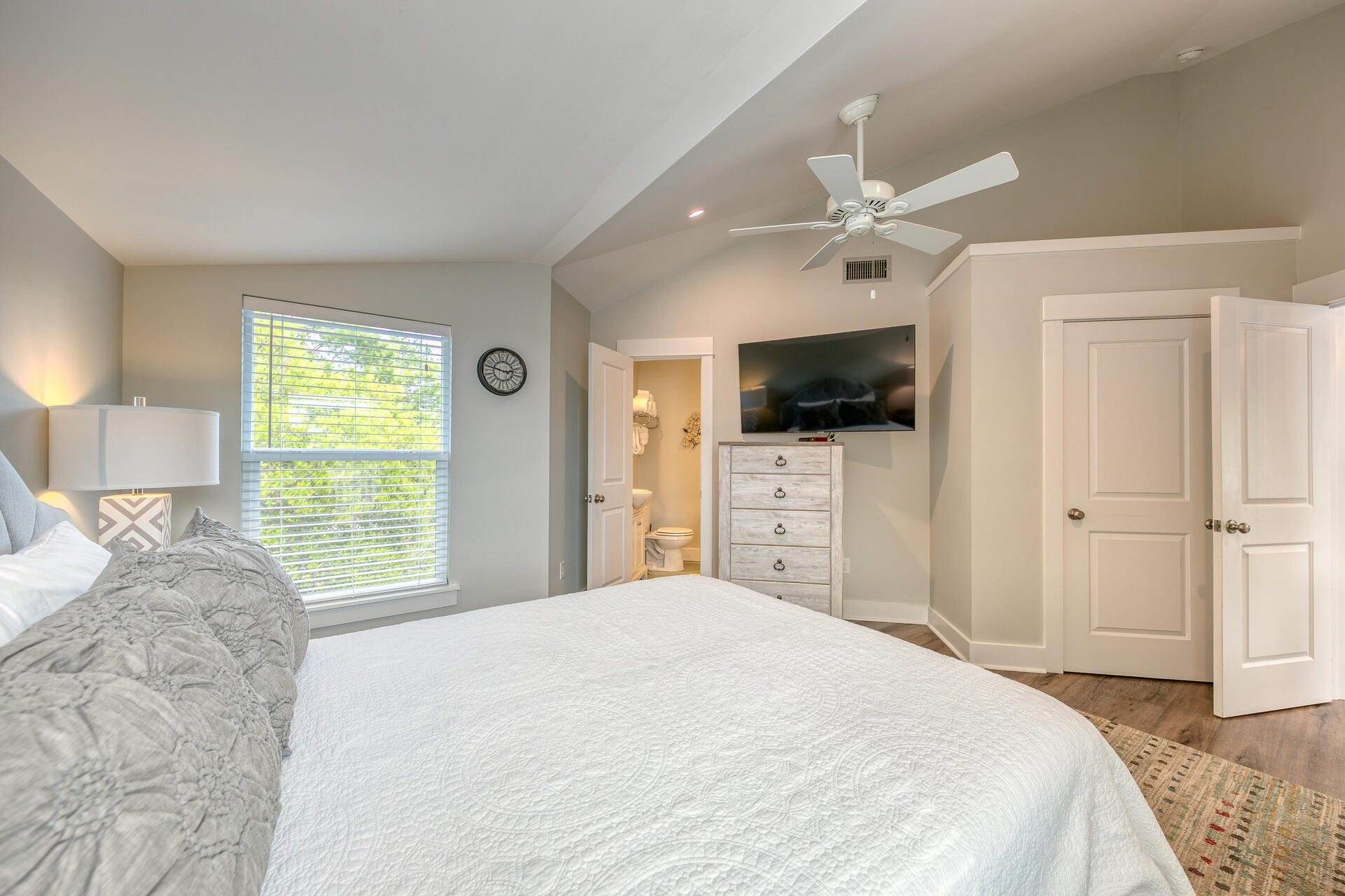 18 Blue Lake Road Santa Rosa Beach, FL 32459 - Photo 14 of 25 a bedroom with a bed and a flat screen tv