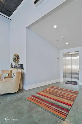a living room with furniture a fireplace and a table
