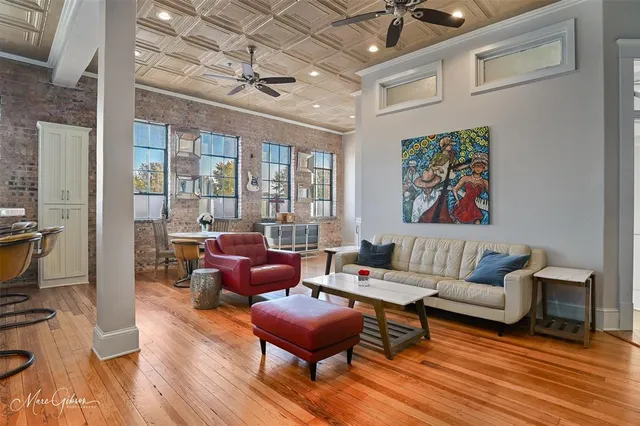 a dining room with furniture and wooden floor