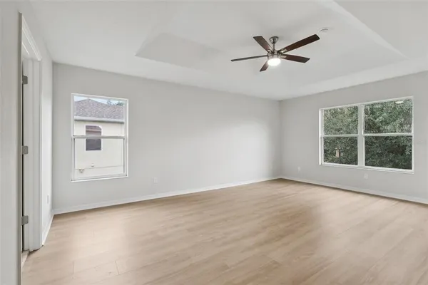 a view of an empty room and wooden floor