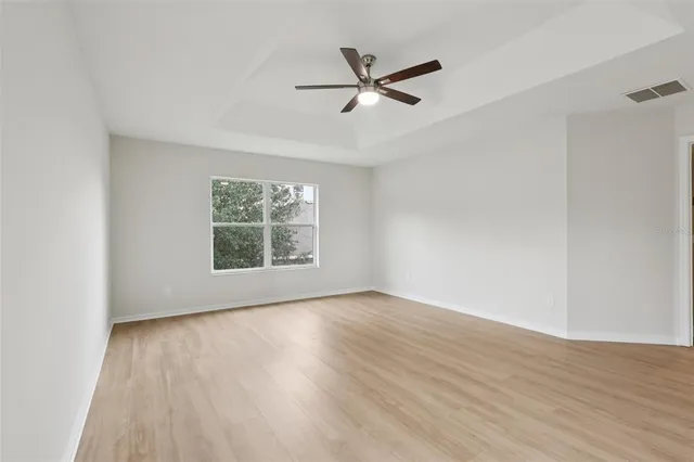 a view of a room with wooden floor