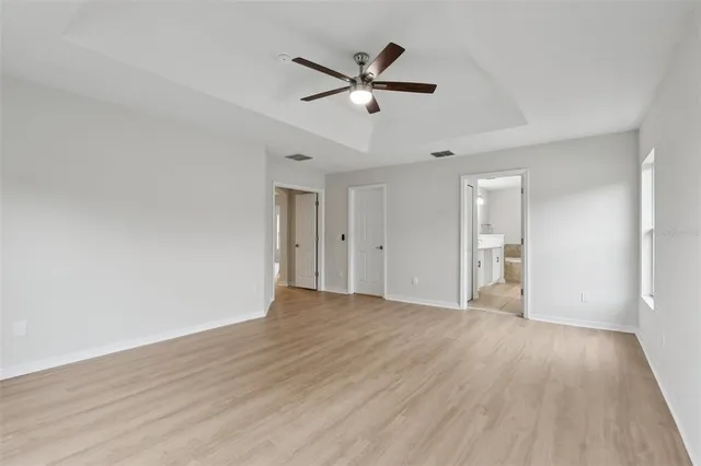 a bathroom with a bathtub shower sink and mirror