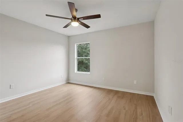 a bathroom with a double vanity sink mirror and toilet