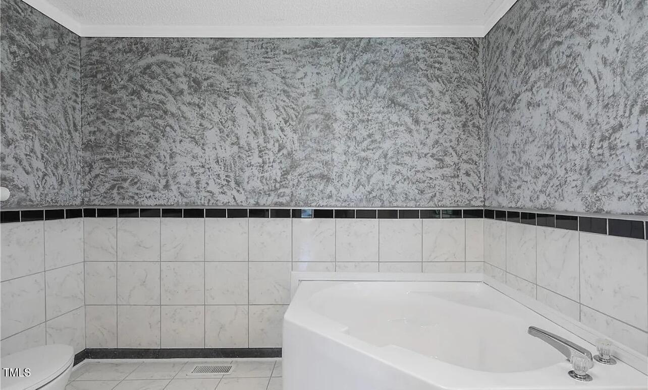 2455 McLean Chapel Church Road Bunnlevel, NC 28323 - Photo 13 of 21 a bathroom with a bathtub