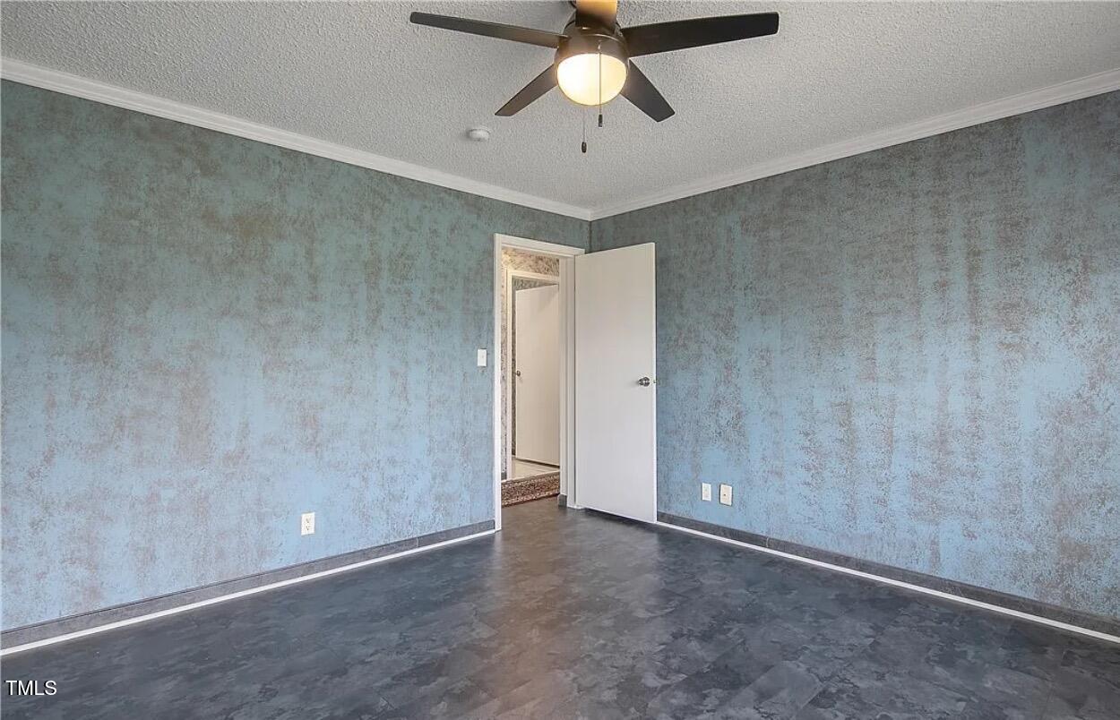 2455 McLean Chapel Church Road Bunnlevel, NC 28323 - Photo 17 of 21 an empty room with chandelier fan
