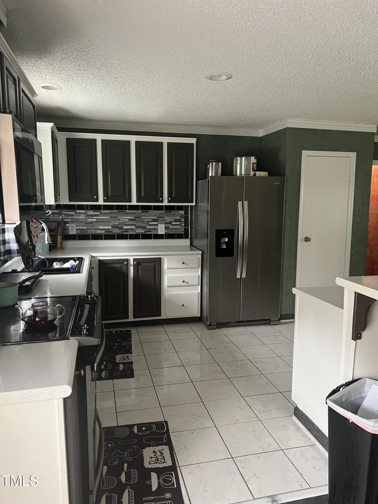 2455 McLean Chapel Church Road Bunnlevel, NC 28323 - Photo 4 of 21 a kitchen with a stove and a refrigerator