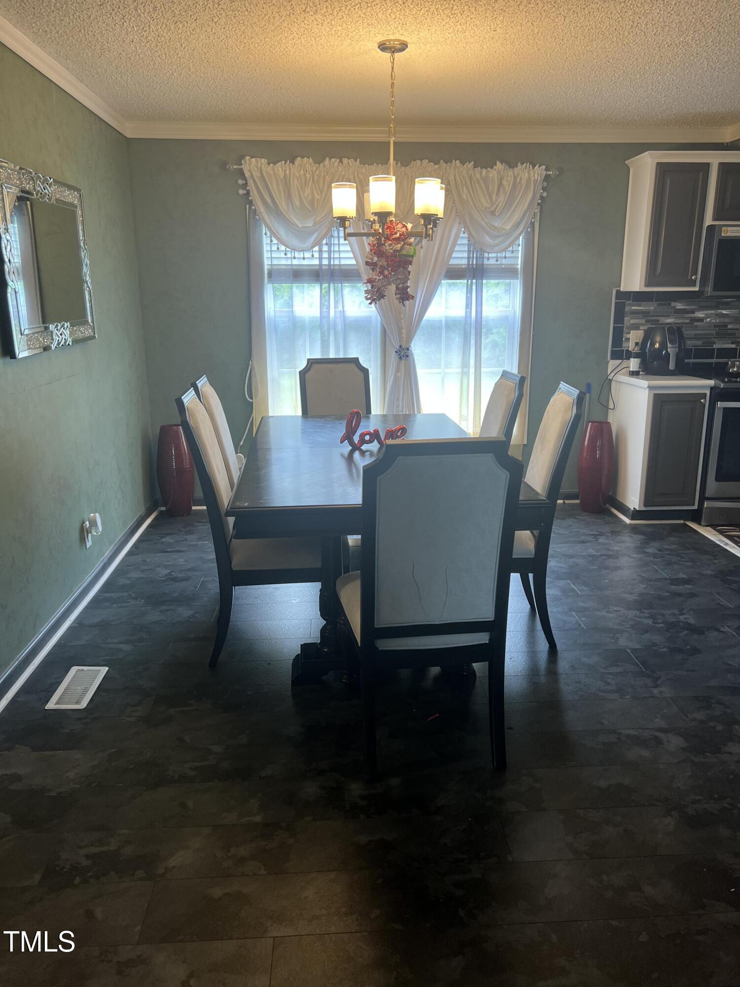 2455 McLean Chapel Church Road Bunnlevel, NC 28323 - Photo 5 of 21 a view of a dining room with furniture window and wooden floor