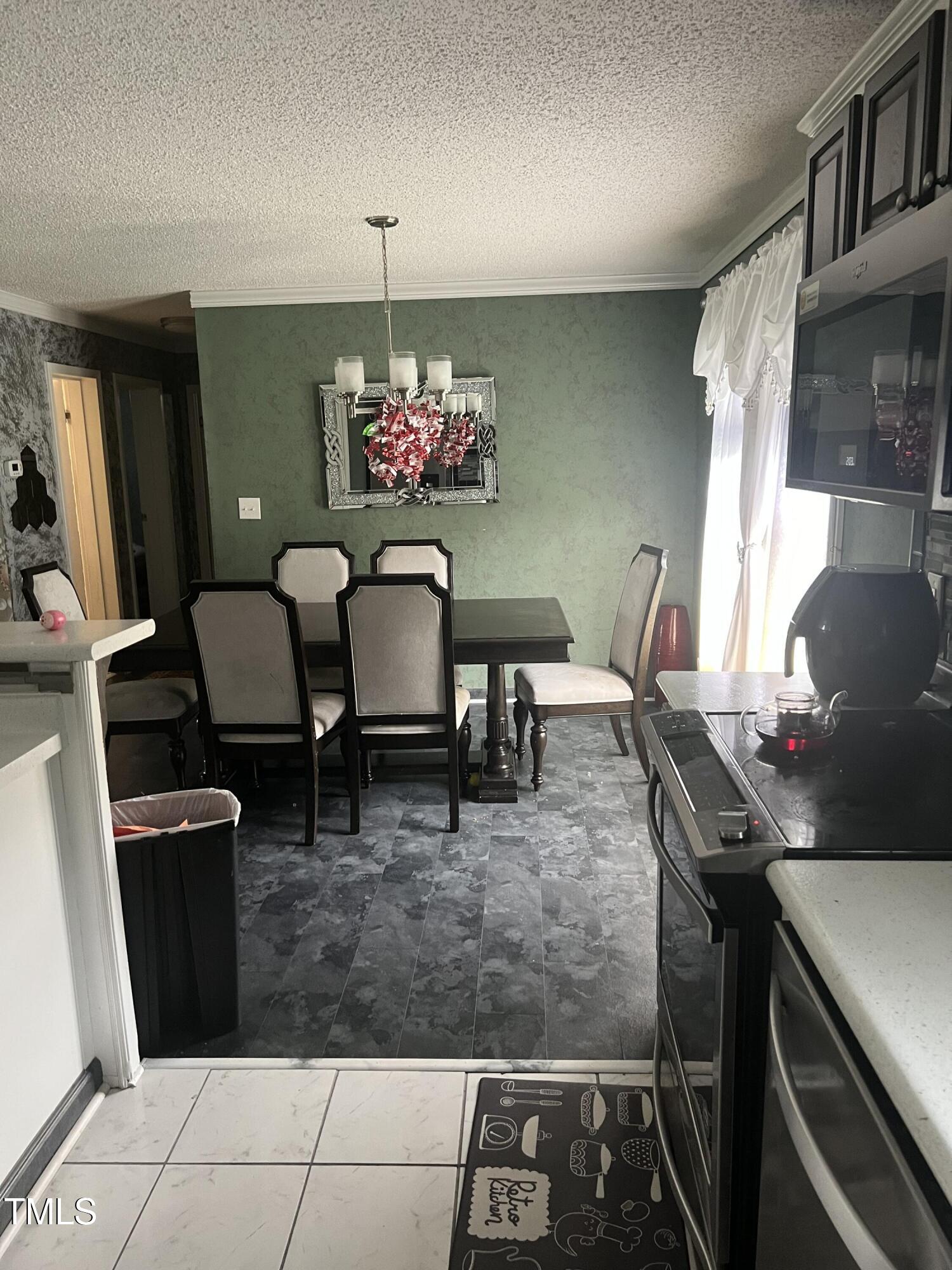 2455 McLean Chapel Church Road Bunnlevel, NC 28323 - Photo 6 of 21 a view of a dining room with furniture and chandelier