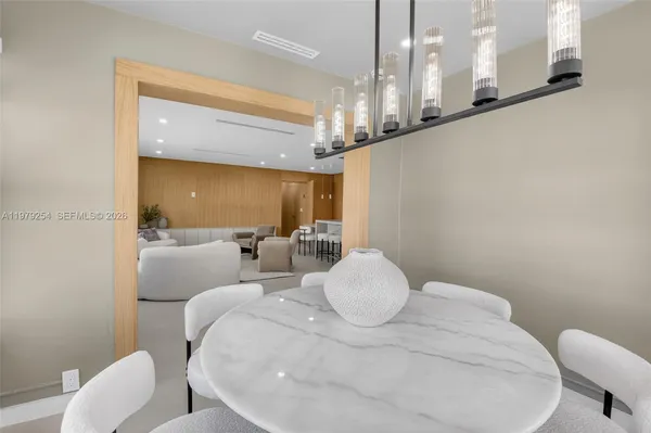 a large white bed in a white room