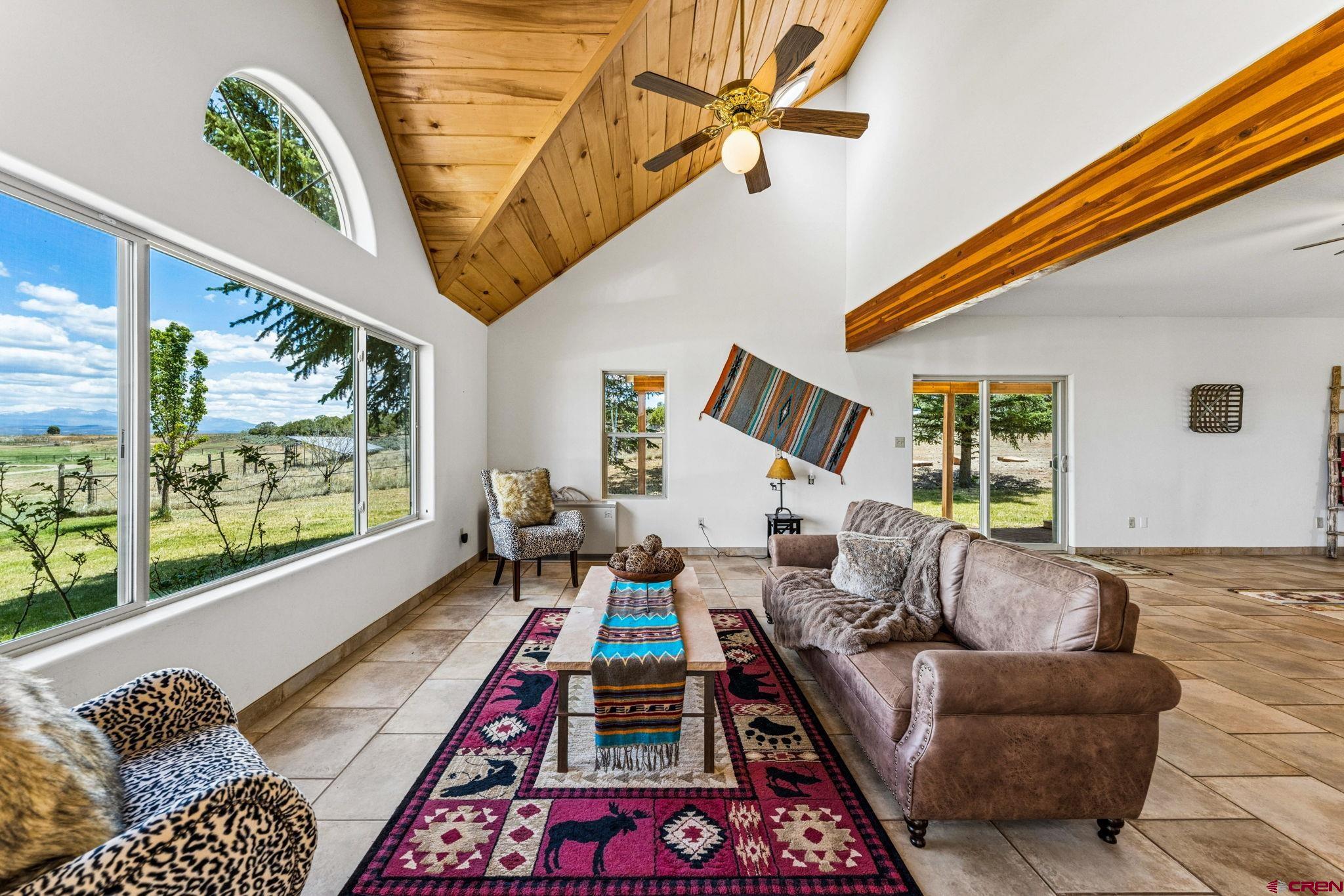 22480 Rd L Cortez, CO 81321 - Photo 3 of 44 a living room with furniture and a large window