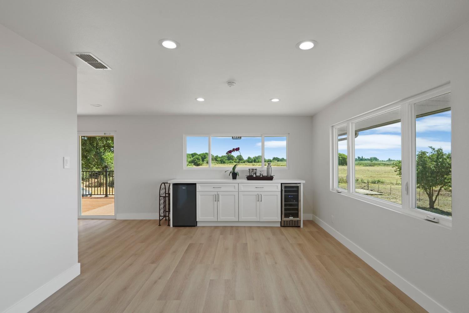 2650 West Twitchell Island Road Rio Vista, CA 94571 - Photo 36 of 60 a kitchen with a white stove top oven and a wooden floor