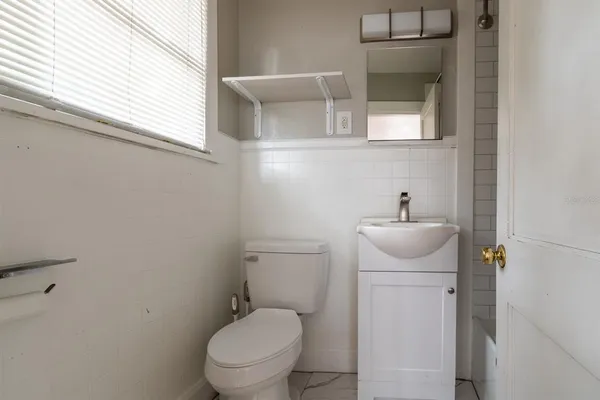 a bathroom with a toilet and a sink
