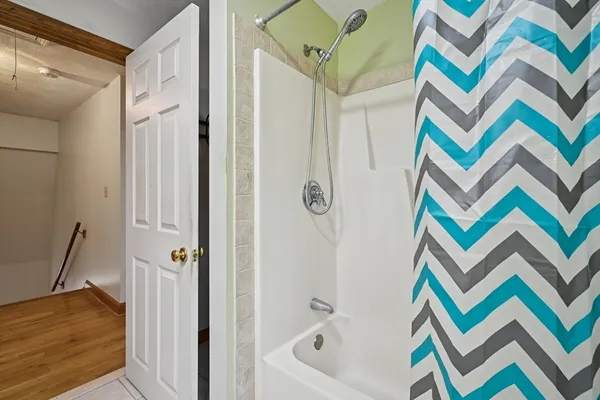 a bathroom with a sink a vanity and a bathtub