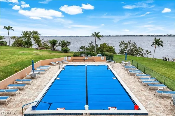 a view of swimming pool with outdoor space and seating area