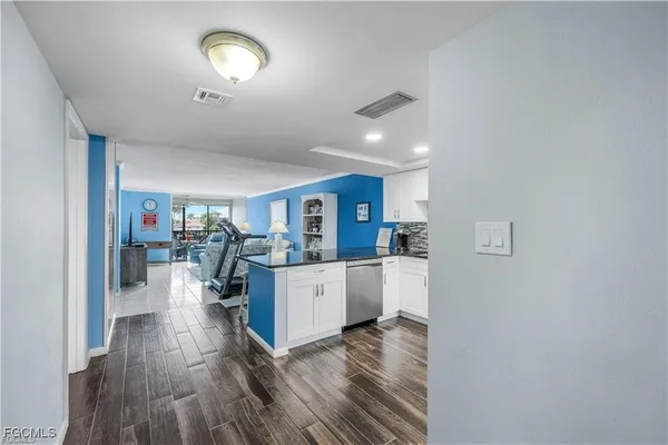 a kitchen with stainless steel appliances a stove sink and microwave