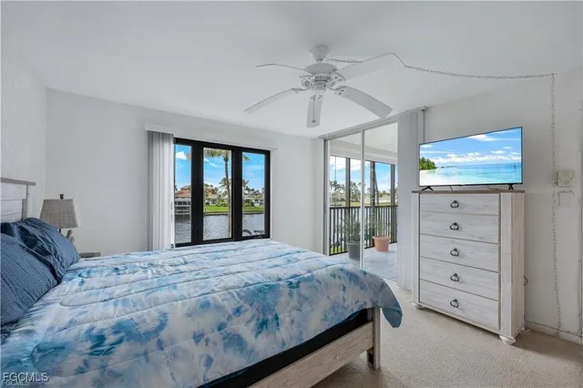 a bathroom with a toilet sink vanity and mirror