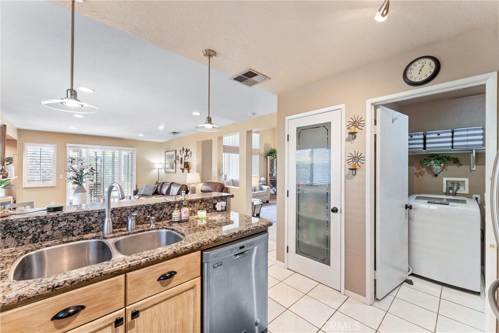 861 Shade Tree Way Corona, CA 92878 - Photo 17 of 47 Pantry with stylish frosted glass door, individual laundry room off the kitchen