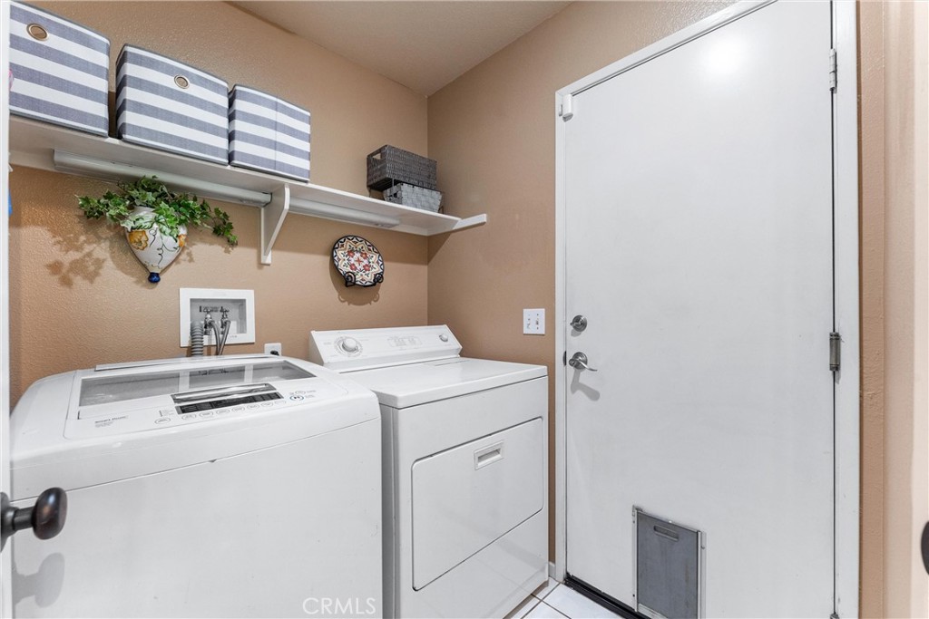 861 Shade Tree Way Corona, CA 92878 - Photo 19 of 47 Individual Laundry Room off the kitchen, doors leads to the two car enclosed garage