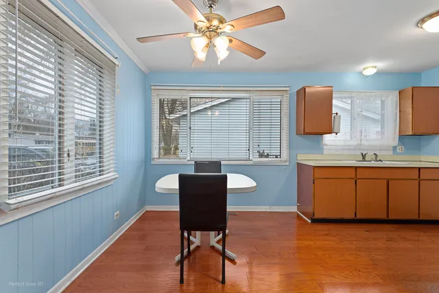 a kitchen with a sink cabinets and window
