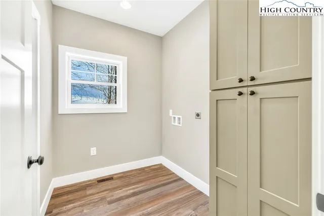 a bathroom with a granite countertop sink and mirror