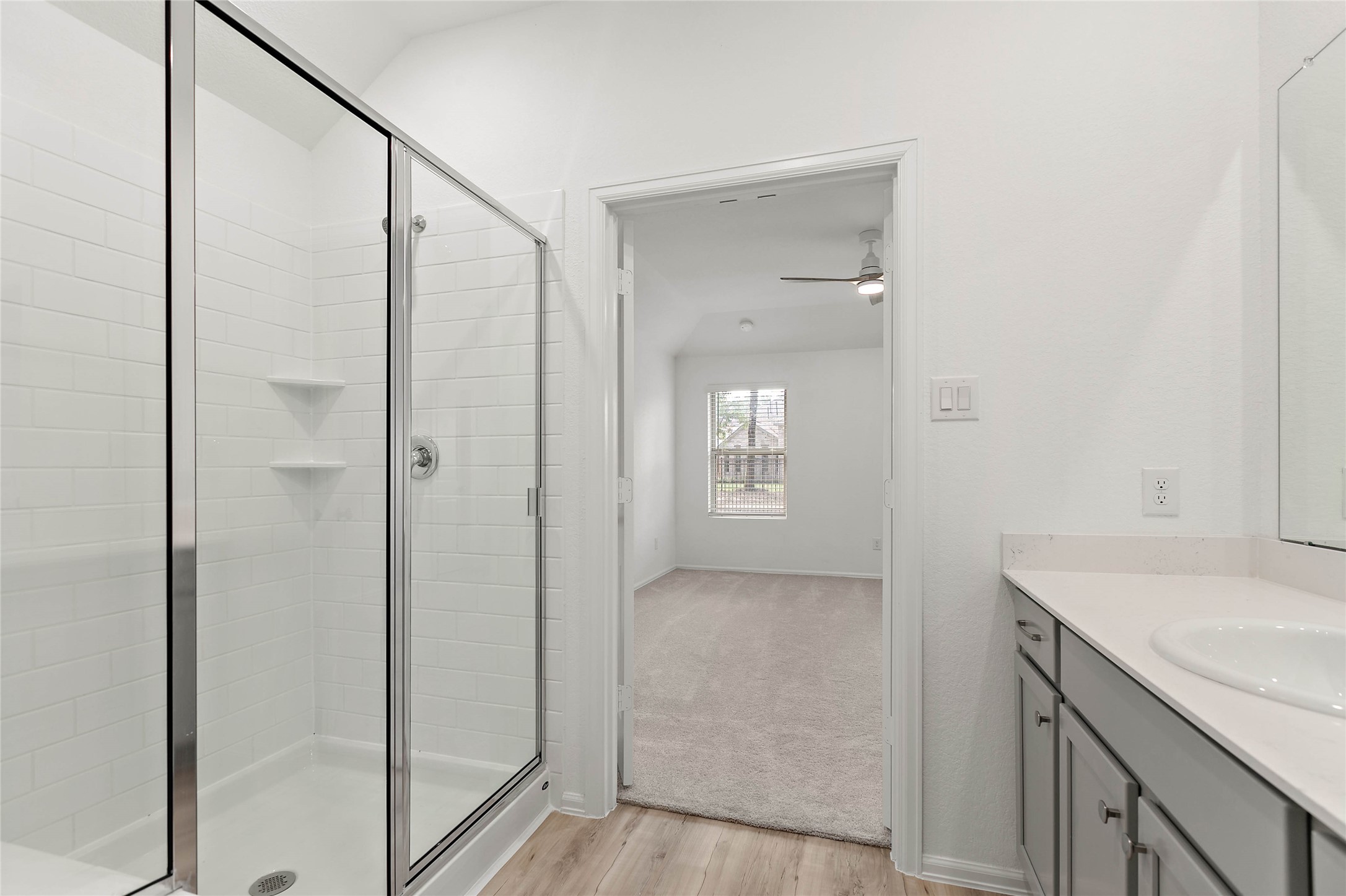 7602 Angels Lndg Lane Porter, TX 77365 - Photo 19 of 32 A separate shower is found in the primary ensuite bathroom.
