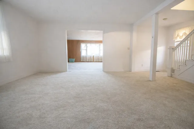 a view of empty room with windows