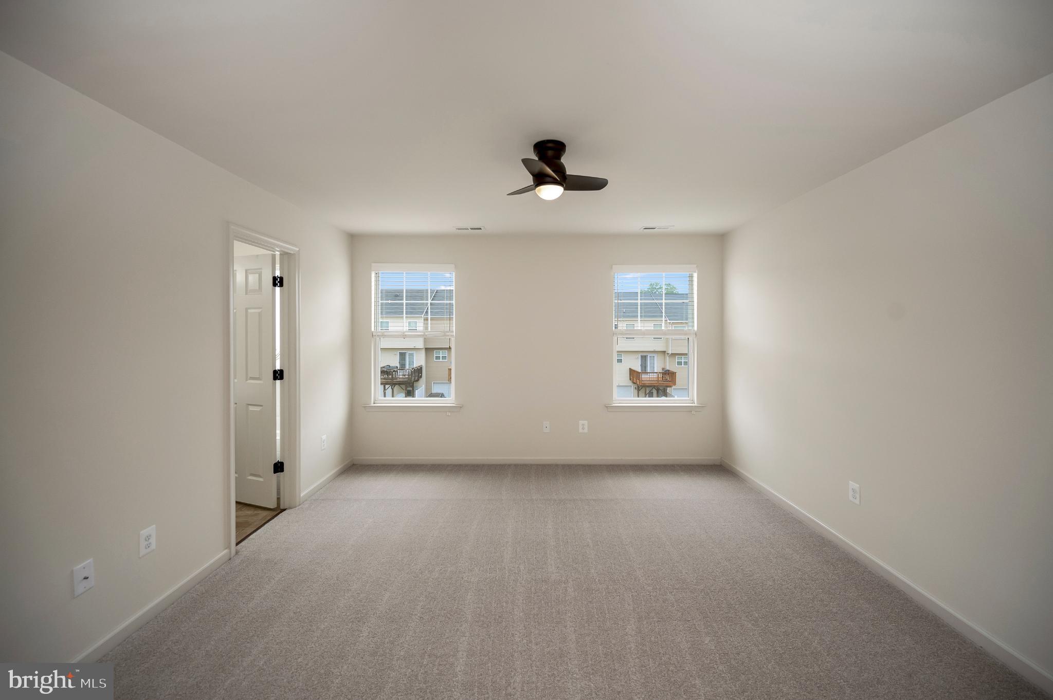 18323 Congressional Circle Ruther Glen, VA 22546 - Photo 26 of 75 Spacious Primary Bedroom w/ Ensuite