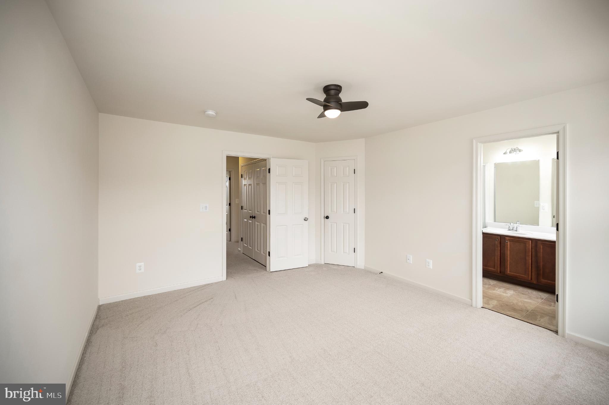 18323 Congressional Circle Ruther Glen, VA 22546 - Photo 29 of 75 Primary Bedroom w/ Walk-in Closet