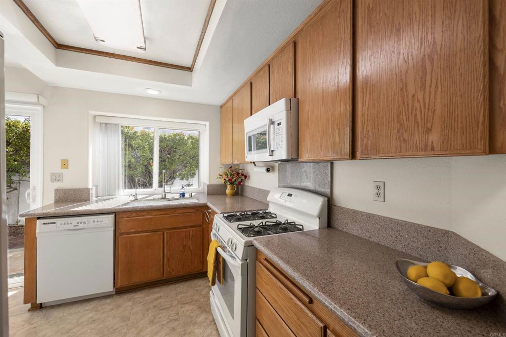 4125 Arcadia Way Oceanside, CA 92056 - Photo 13 of 51 a kitchen that has a sink and a stove