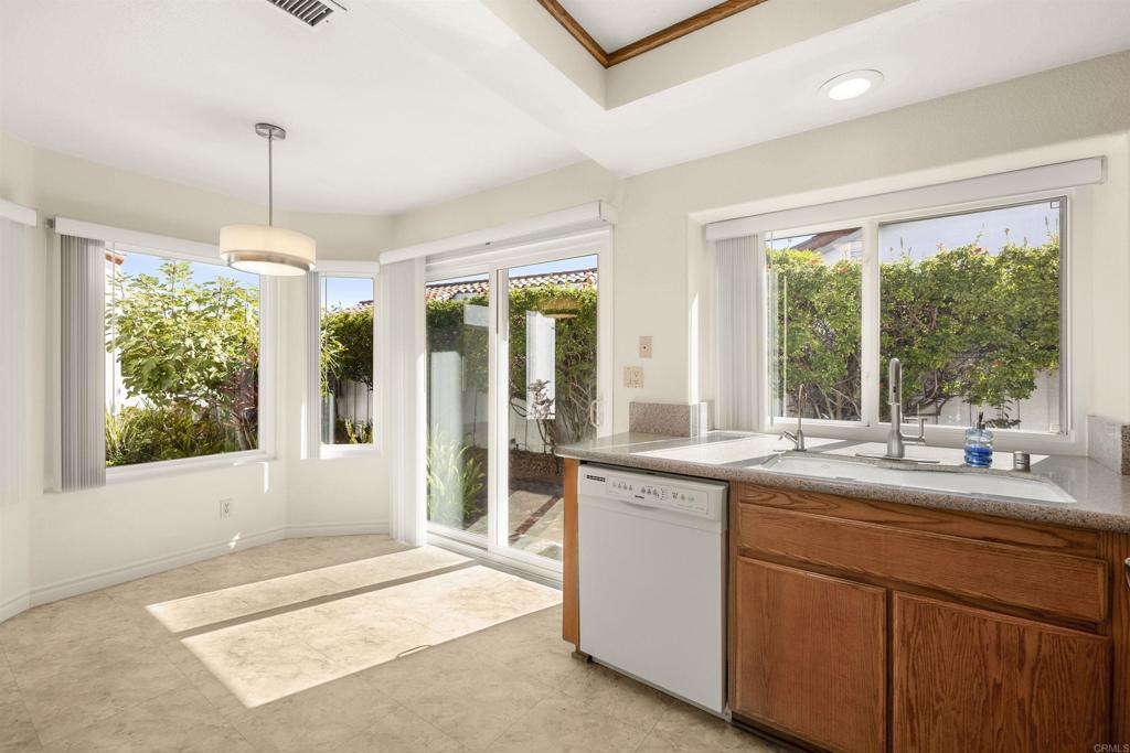 4125 Arcadia Way Oceanside, CA 92056 - Photo 14 of 51 a kitchen with a sink and large window