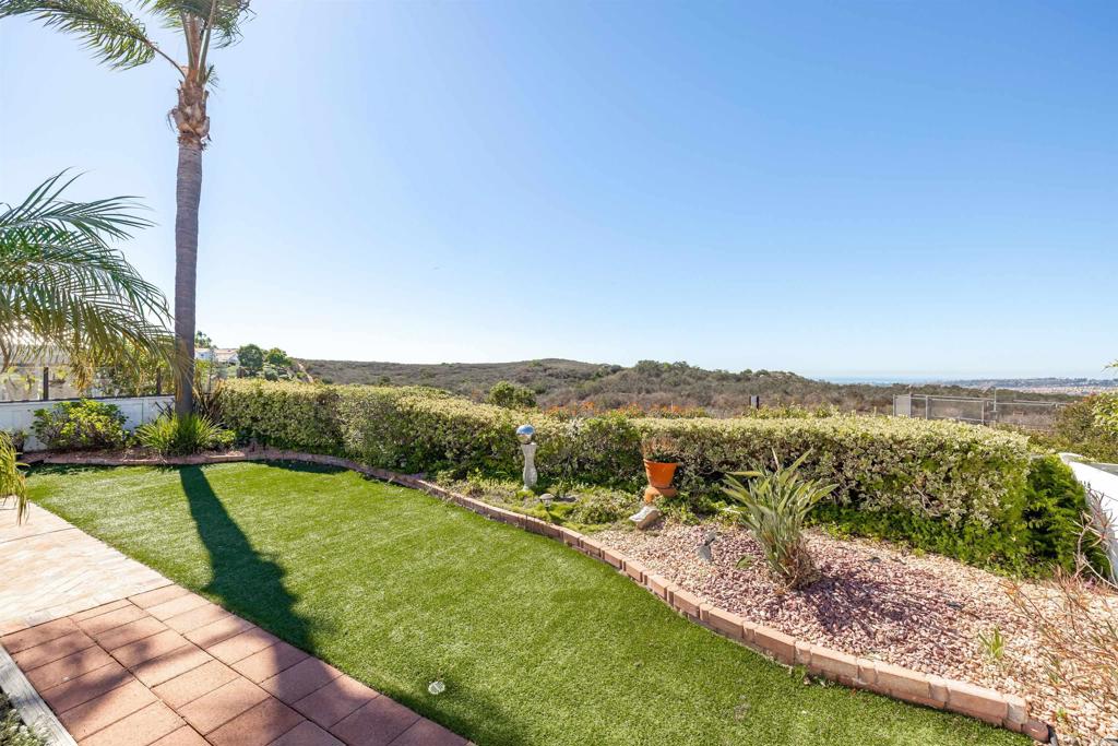 4125 Arcadia Way Oceanside, CA 92056 - Photo 22 of 51 a view of a backyard with a garden