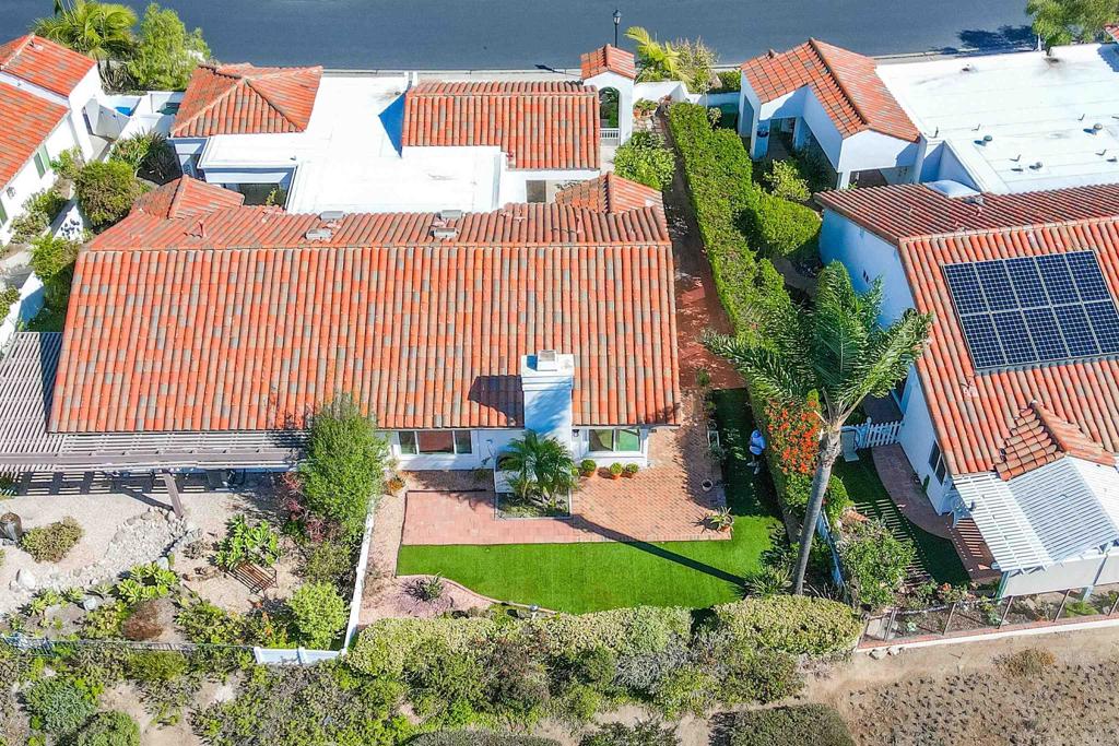 4125 Arcadia Way Oceanside, CA 92056 - Photo 23 of 51 a view of a house with a yard and potted plants
