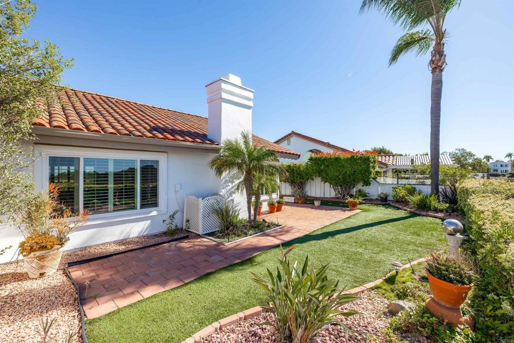 4125 Arcadia Way Oceanside, CA 92056 - Photo 24 of 51 a front view of a house with garden and patio
