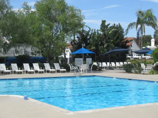 a view of a swimming pool with a patio