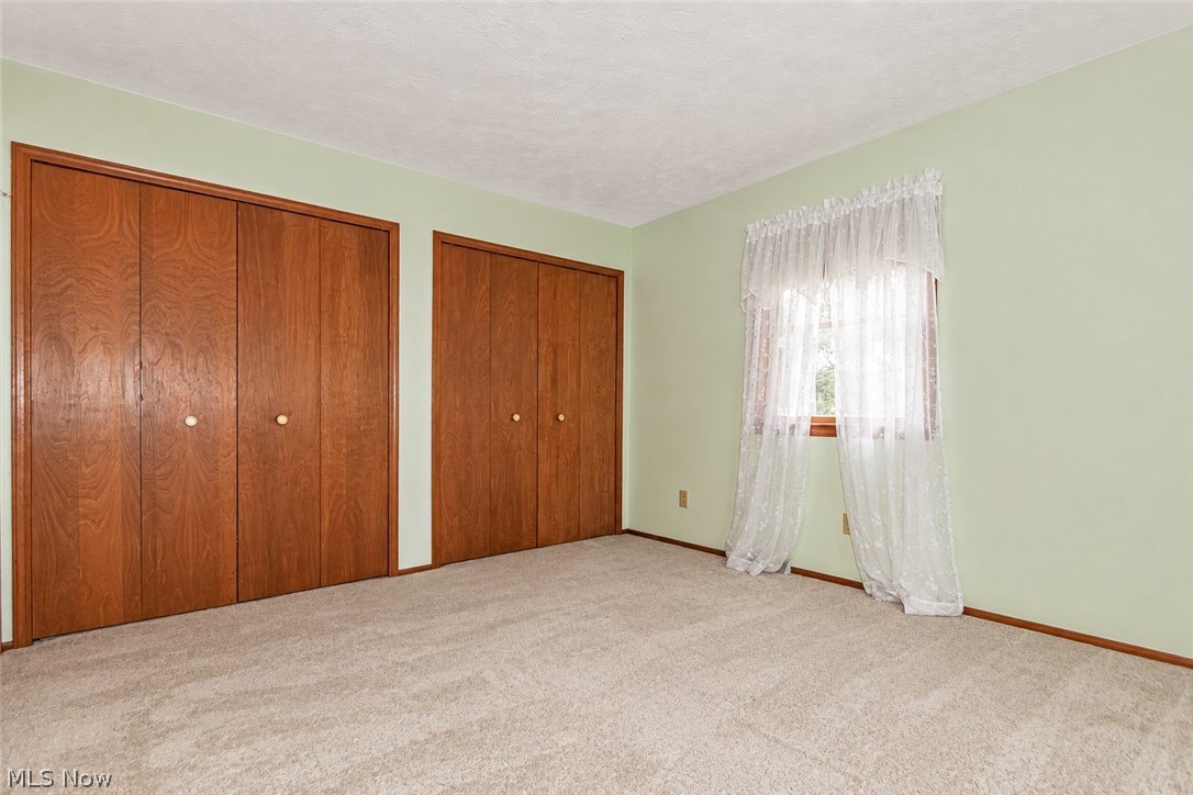 12066 Huntoon Road Painesville, OH 44077 - Photo 27 of 46 Another first floor spacious bedroom