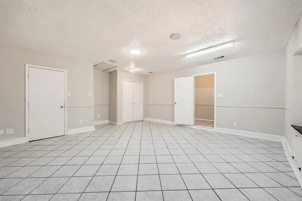 a bathroom with a toilet sink and vanity