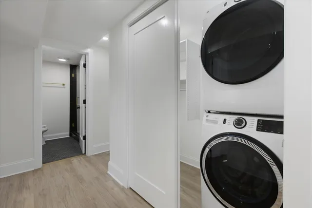 a view of a hallway with washer and dryer