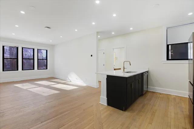 a kitchen with a sink and a window