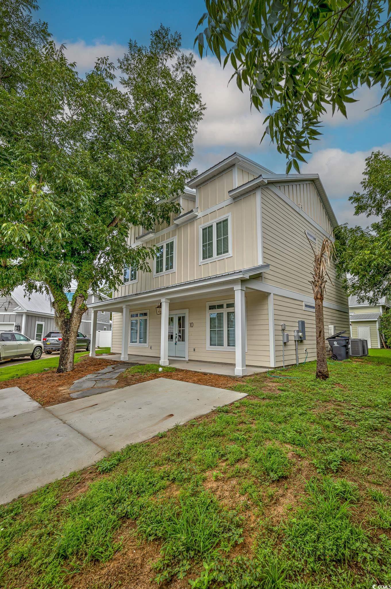 10 Saltwater Way Murrells Inlet, SC 29576 - Photo 1 of 30 View of front of home featuring a porch and a gara
