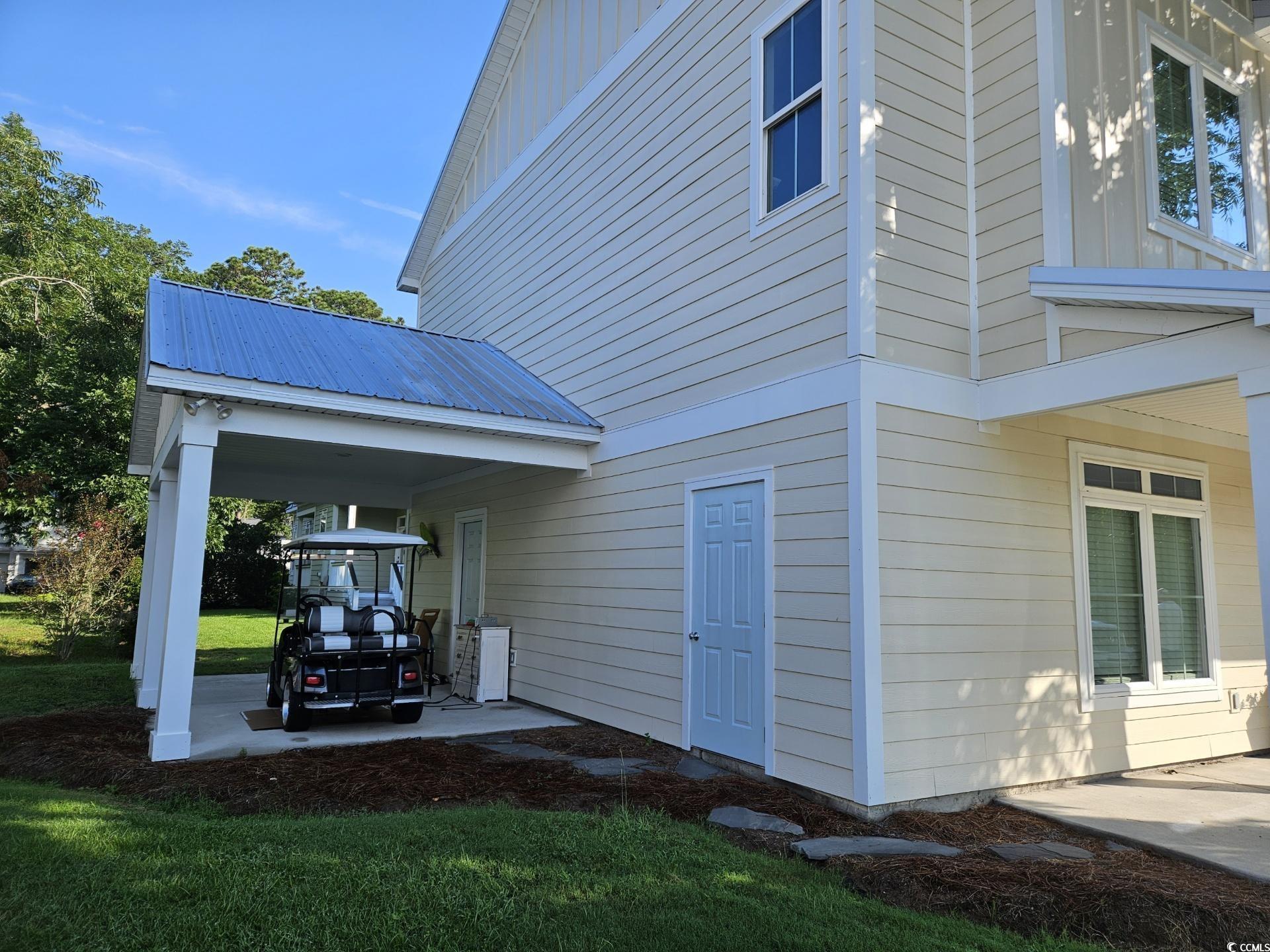 10 Saltwater Way Murrells Inlet, SC 29576 - Photo 25 of 30 View of home's exterior featuring a lawn