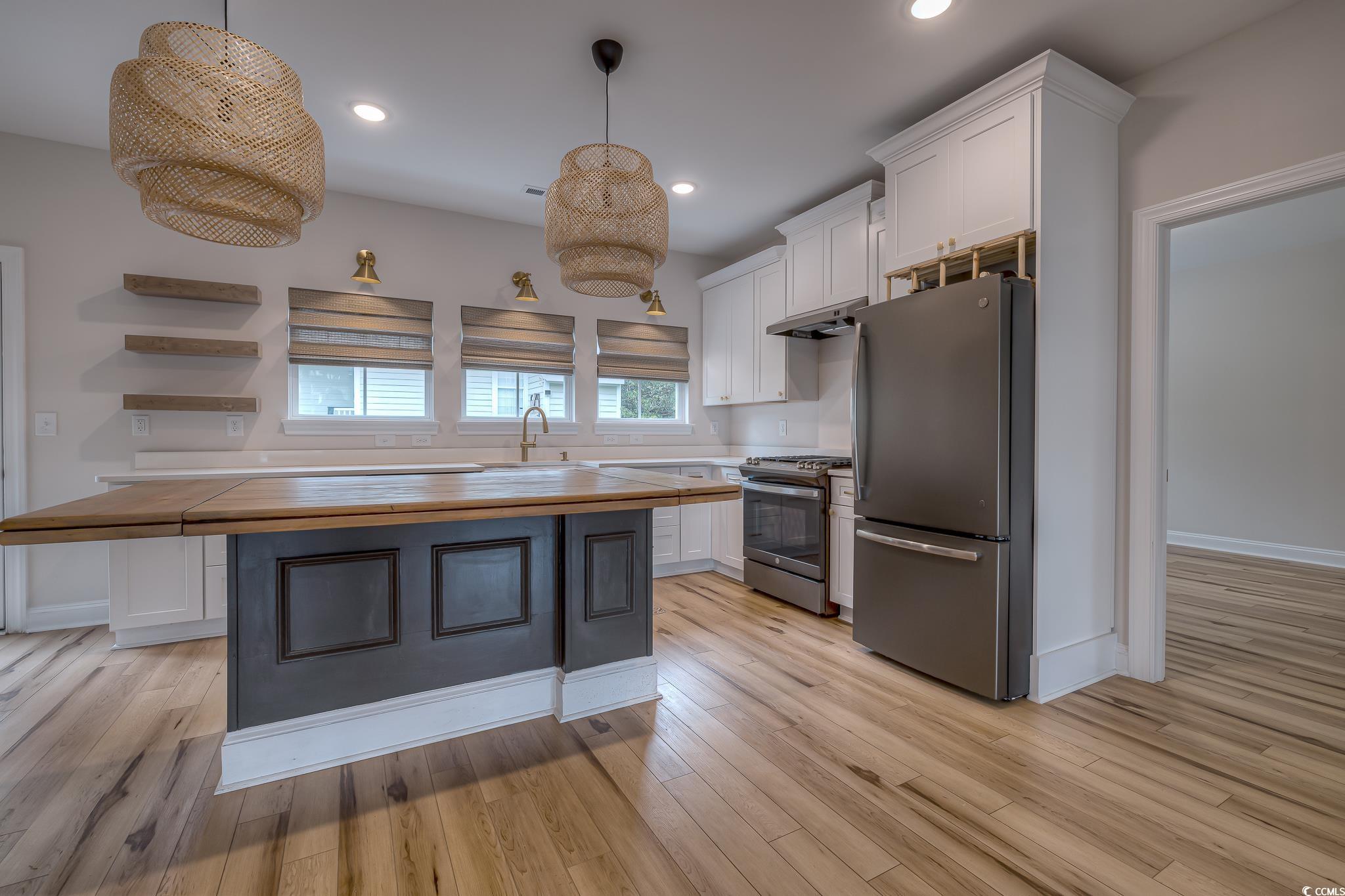 10 Saltwater Way Murrells Inlet, SC 29576 - Photo 9 of 30 Kitchen with butcher block countertops, light hard