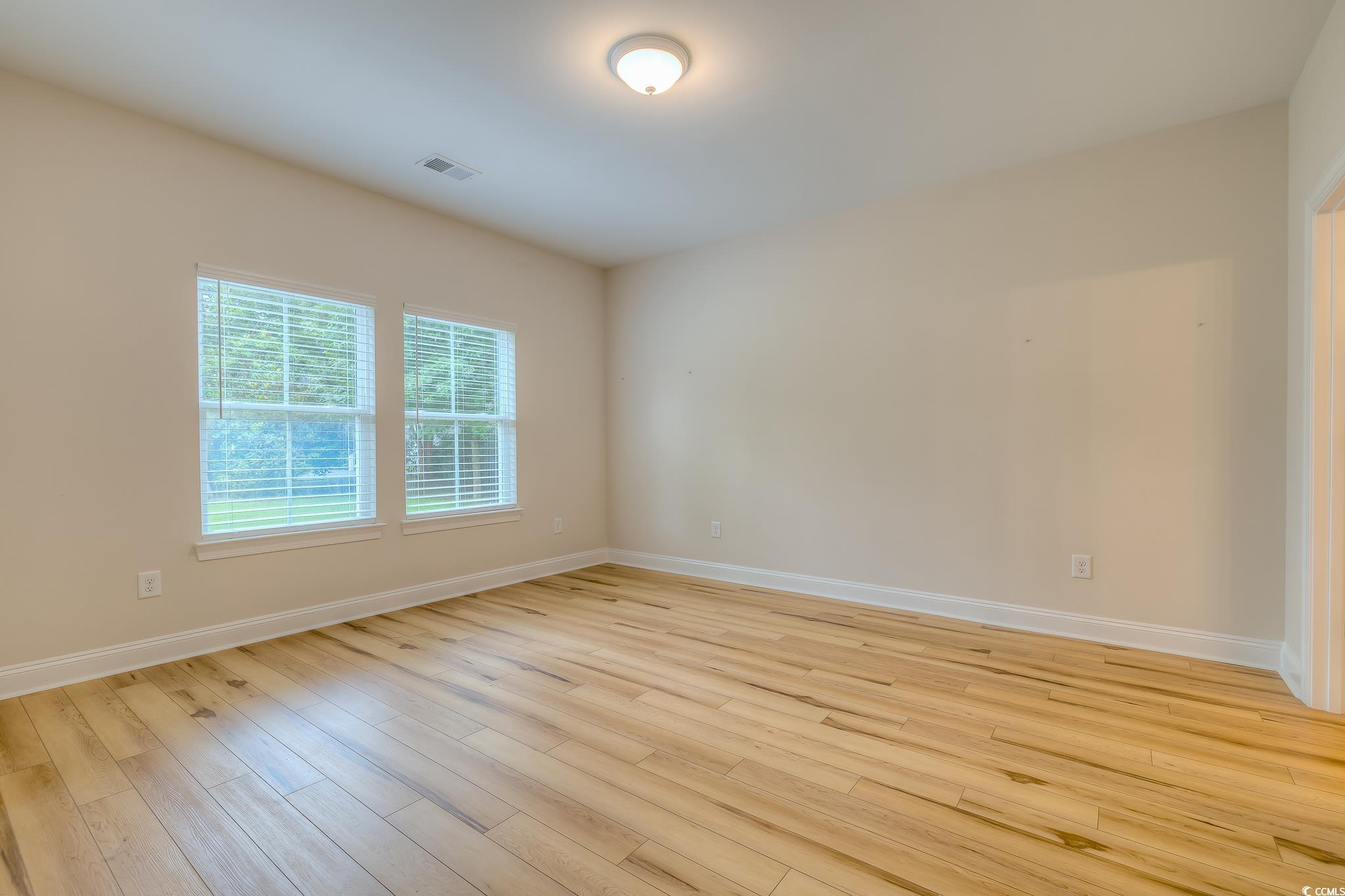 10 Saltwater Way Murrells Inlet, SC 29576 - Photo 10 of 30 Empty room featuring light wood-type flooring
